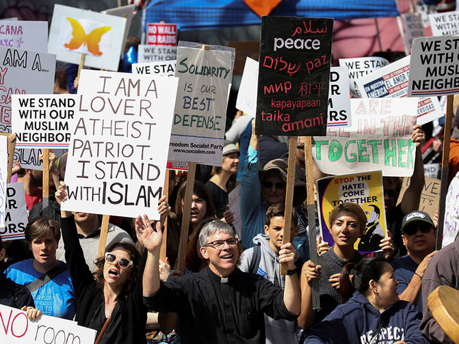Counterprotesters hold signs and shout slogans during an anti-Shariah rally in Seattle on June 10, 2017. Photo courtesy of Reuters/David Ryder