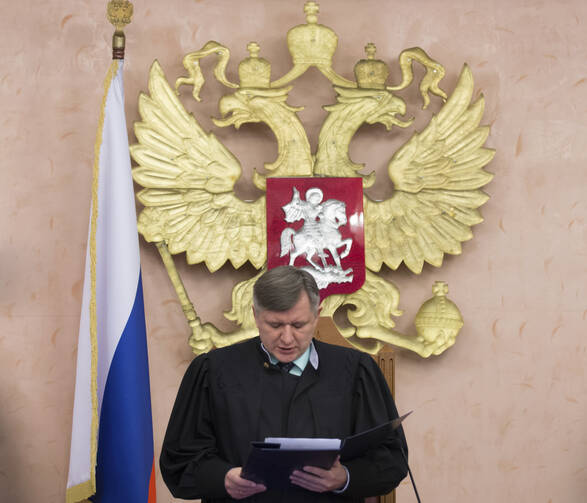 Russia's Supreme Court judge Yuri Ivanenko reads the decision in a court room in Moscow, Russia, on Thursday, April 20, 2017. (AP Photo/Ivan Sekretarev)