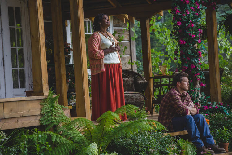 Papa (Octavia Spencer) and Mack Phillips (Sam Worthington) in "The Shack." (Photo Credit: Jake Giles Netter) 