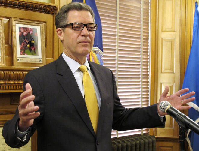 Kansas Gov. Sam Brownback speaks during a news conference at the Statehouse in Topeka, Kan., June 7 (AP Photo/John Hanna).