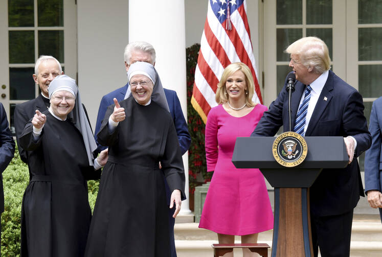 U.S President Donald Trump with members of the Little Sisters of the Poor in the White House rose garden on May 4 (Photo by Olivier Douliery/ Abaca (Sipa via AP Images)