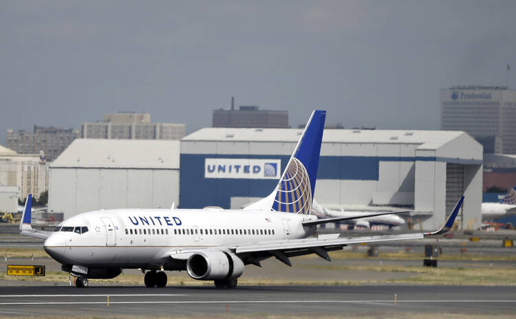 In this Sept. 8, 2015, file photo, a United Airlines passenger plane lands at Newark Liberty International Airport in Newark, N.J. Twitter users are poking fun at United's tactics in having a man removed from an overbooked Chicago to Louisville flight on April 9, 2017. (AP Photo/Mel Evans, File)