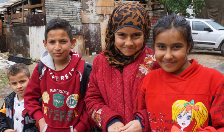 Syrian refugee children stand outside their school in Zahle, Lebanon, in the country's Bekaa Valley April 12. (CNS photo/Dale Gavlak) 