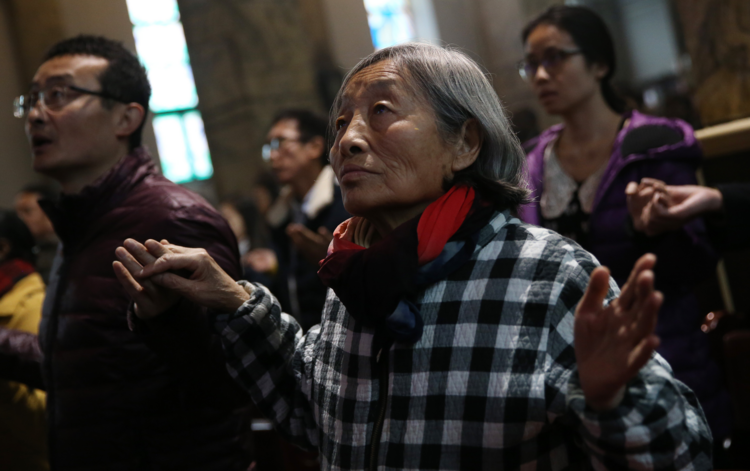 Worshippers pray during a Dec. 4 Mass in the Cathedral of the Immaculate Conception in Beijing. (CNS photo/How Hwee Young, EPA)