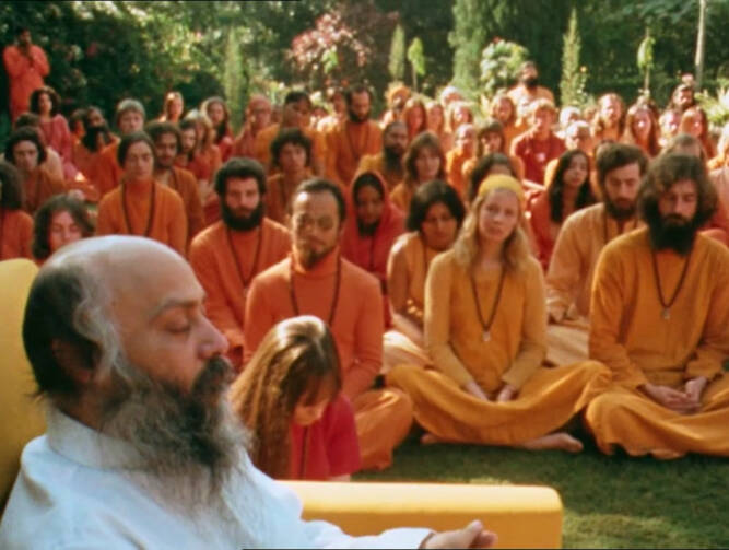 Bhagwan Shree Rajneesh and his disciples at Rajneeshpuram (Credit: Netflix)