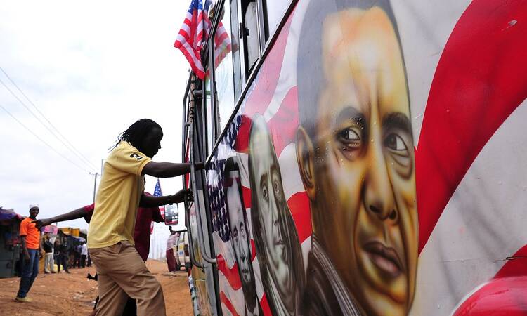 A man boards a matatu minibus adorned with Barack Obama, head of the US president’s visit. Photograph: Simon Maina/AFP/Getty Images