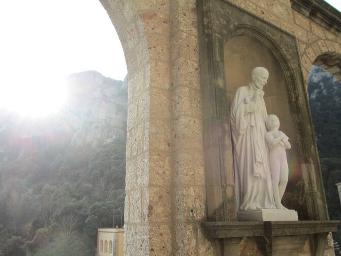 Outside the Benedictine Abbey at Montserrat, in Montserrat, Spain, where St. Ignatius laid down his sword and armor. Photo by Matt Emerson.