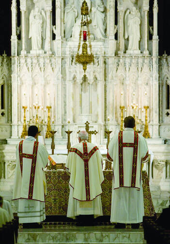 Bishop Edward J. Slattery of Tulsa, Okla., faces the crucifix on the altar as he celebrates Mass in June 2009 at Holy Family Cathedral (CNS photo/Dave Crenshaw, Eastern Oklahoma Catholic).