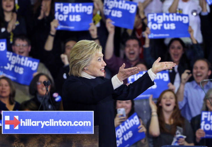 Democratic presidential candidate Hillary Clinton gestures to supporters on Tuesday night in Hooksett, N.H. (AP Photo/Elise Amendola)