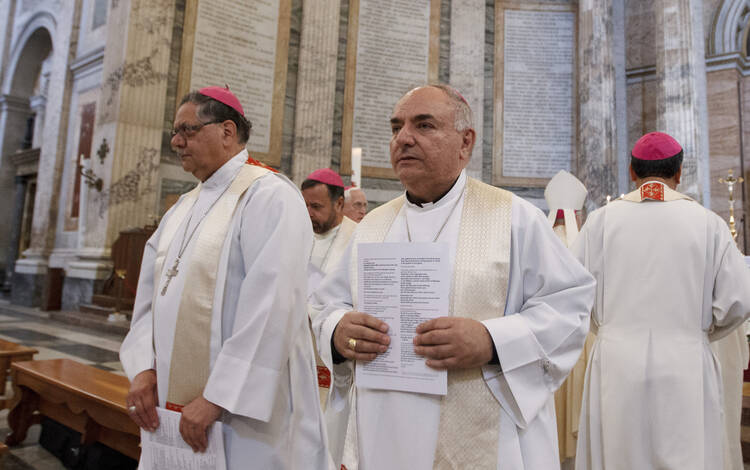 Bishop Gerald Barnes of San Bernadino, center