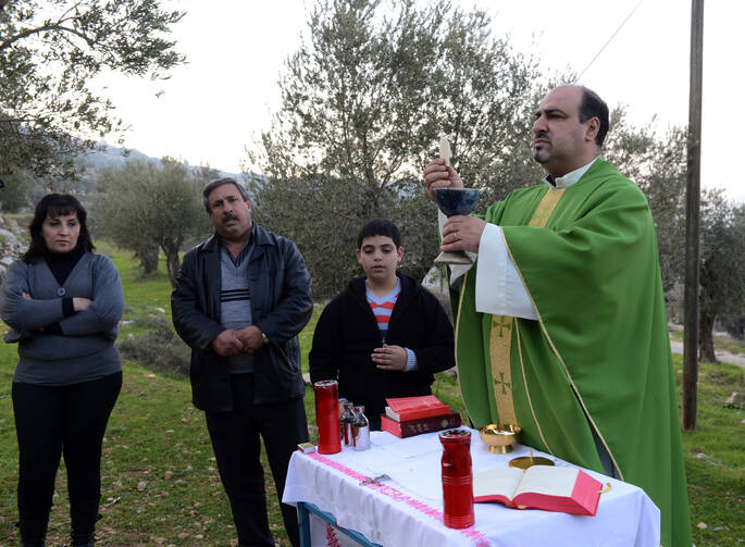 An outdoor Mass near the Salesian monastery in Beit Jalla on Jan. 18.