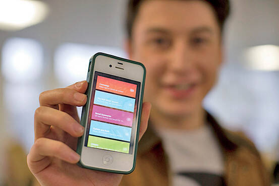 Nicholas D'Aloisio displays his smart phone app (Associated Press)