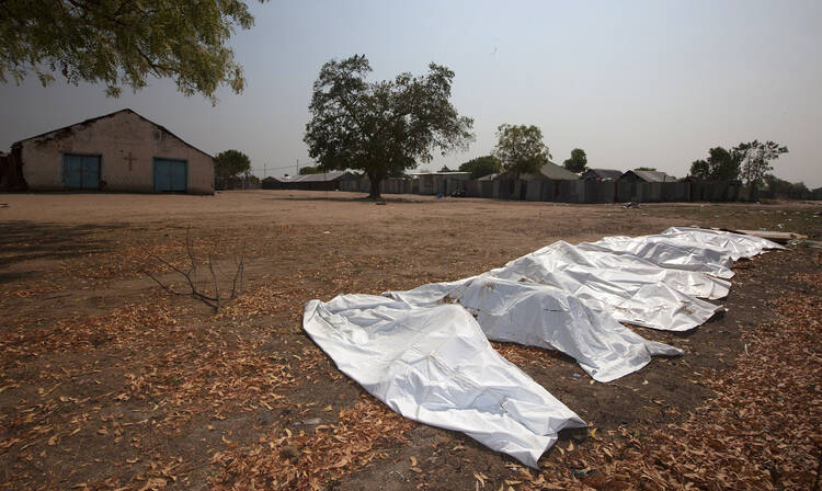 Sixteen body bags are lined up outside St. Andrews Episcopal Church, in Bor, South Sudan, on Jan. 27.