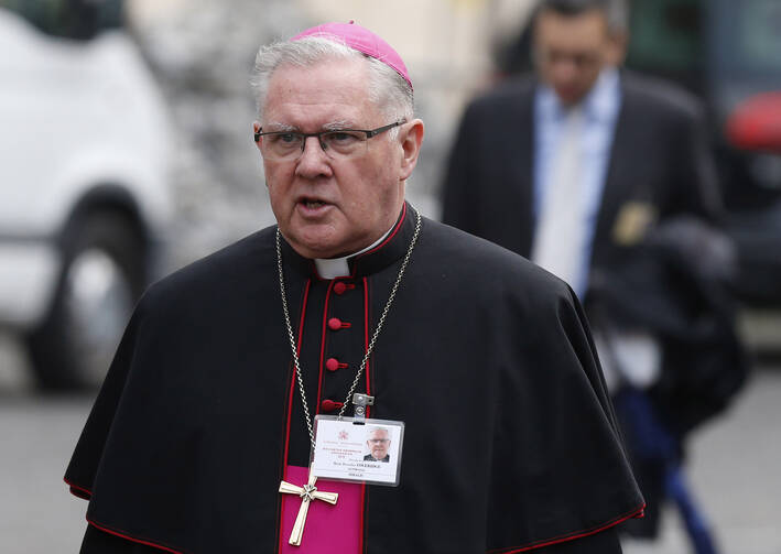 Archbishop Mark Coleridge of Brisbane, Australia, arrives for a session of the Synod of Bishops on the family at the Vatican, Oct. 14 (CNS photo/Paul Haring).