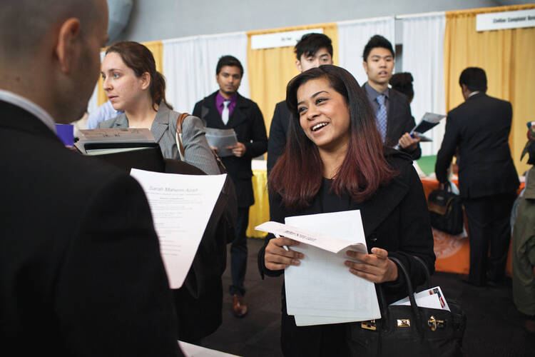 Now Hiring: Sarah Azad, a senior majoring in telecommunications, at a job and internship fair in New York, April, 2012. 