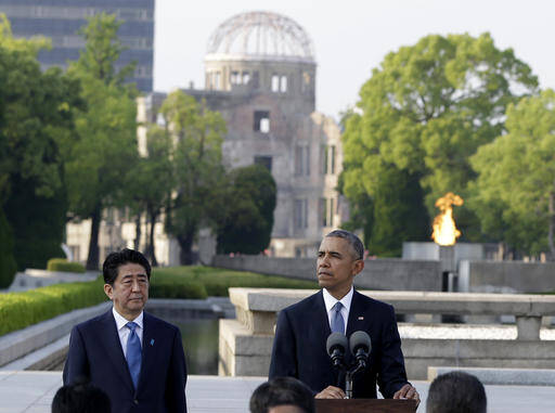 U.S. President Barack Obama delivers remarks, accompanied by Japanese Prime Minister Shinzo Abe at Hiroshima Peace Memorial Park in Hiroshima, western Japan. (AP Photo/Carolyn Kaster)