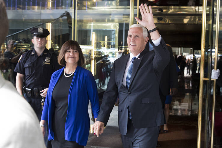 Indiana Gov. Mike Pence, accompanied by his wife Karen, waves as they leave a meeting with Republican presidential candidate Donald Trump at Trump Tower in New York, Friday, July 15, 2016. (AP Photo/Evan Vucci)