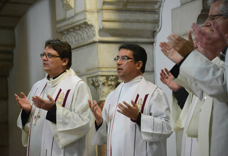 Bishop Oscar Cantu of Las Cruces, N.M., center, prays with other bishops from around the world during Mass Jan. 12 at the Carmelite Monastery in Bethlehem, West Bank. (CNS photo/Debbie Hill)