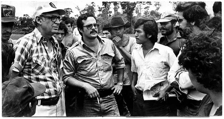 Cardenal, left, with organizers and volunteers for the Sandinista literacy campaign in 1980.