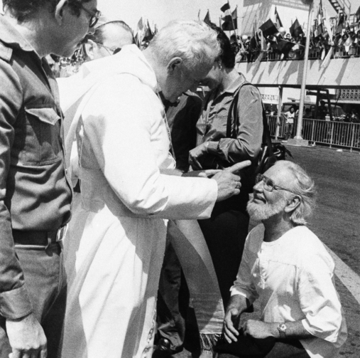 Daniel Ortega flanks Pope John Paul II who wags his finger at culture minister and priest Ernesto Cardenal, during welcoming ceremonies at the airport in Managua, Nicaragua, in March 1983. (AP Photo/Barricada, File)