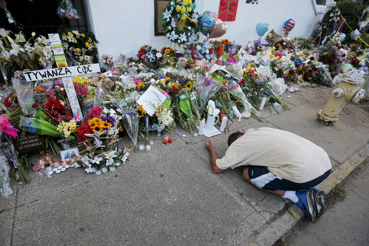 Outside the Emanuel African Methodist Episcopal Church in Charleston, S.C., June 21. Nine African-Americans were shot to death by a young white man at an evening Bible study inside the church on June 17. (CNS photo/Brian Snyder) 