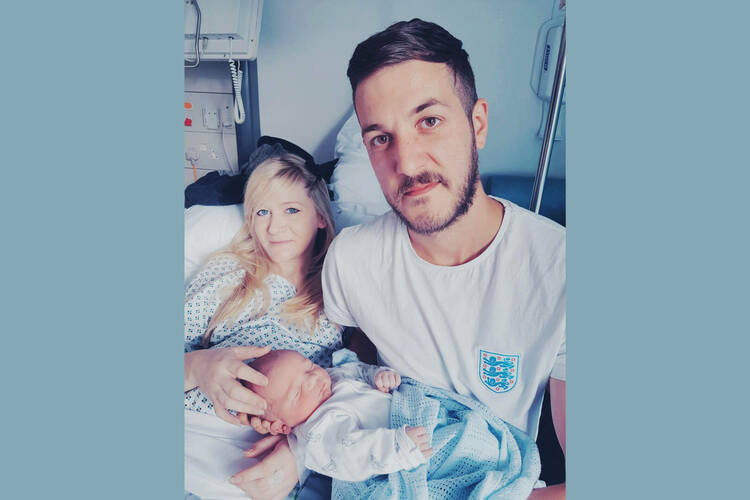 Connie Yates and Chris Gard are pictured with their son, Charlie Gard, who was born with mitochondrial DNA depletion syndrome, in this undated family photo. The U.K. couple have lost their legal battle to keep Charlie on life-support and seek treatment for his rare disease in the United States. (CNS photo/family handout, courtesy Featureworld)