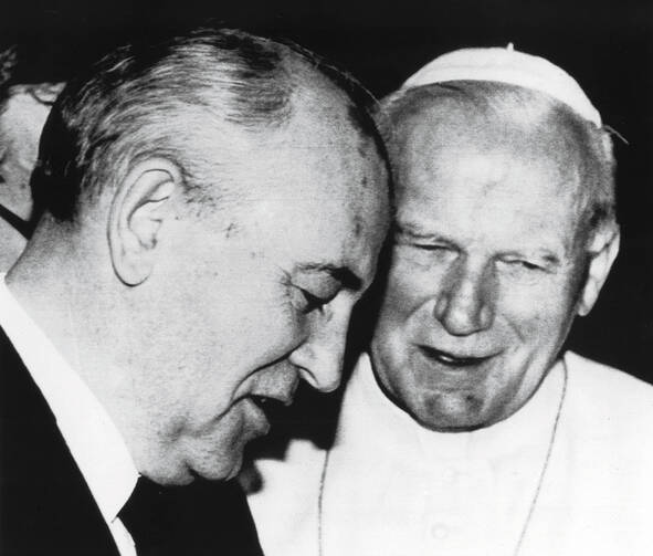 VOICES FOR FREEDOM. Pope John Paul II talks with Russian President Mikhail Gorbachev during a historic 1989 meeting at the Vatican. The two expressed broad agreement on the need for greater religious freedom in the Soviet Union. 