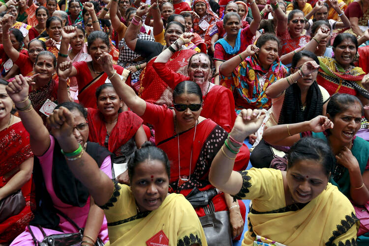 Workers from various trade unions shout slogans during an anti-government protest rally, organized as part of a nationwide strike, in Mumbai, India, Sept. 2. (CNS photo/Danish Siddiqui, Reuters)