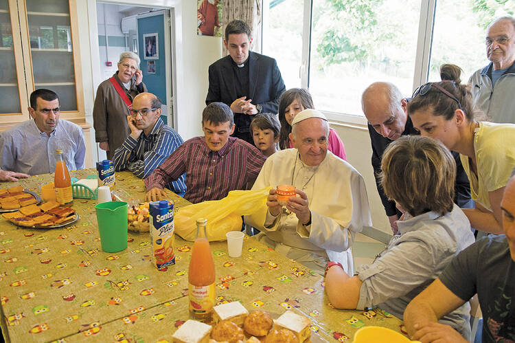 TABLE SERVICE. Pope Francis visits the Il Chicco community, part of the L’Arche movement, in Ciampino, Italy. 