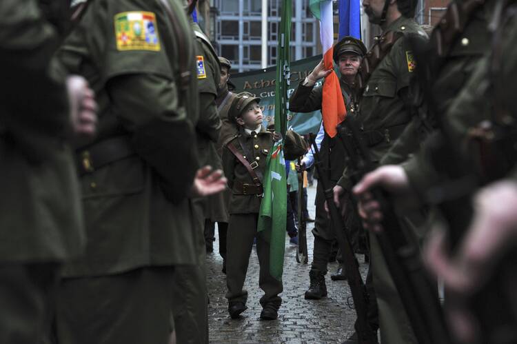Brian Kiernan, 11, attends a Sinn Fein rally with members of the Finglas 1916 Commemoration group in Dublin, Jan. 31 (CNS photo/Clodagh Kilcoyne, Reuters).