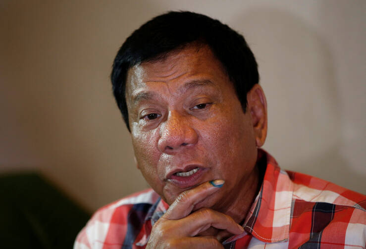 Philippine President-elect Rodrigo Duterte talks to reporters May 9 in Davao City (CNS photo/Erik De Castro, Reuters).