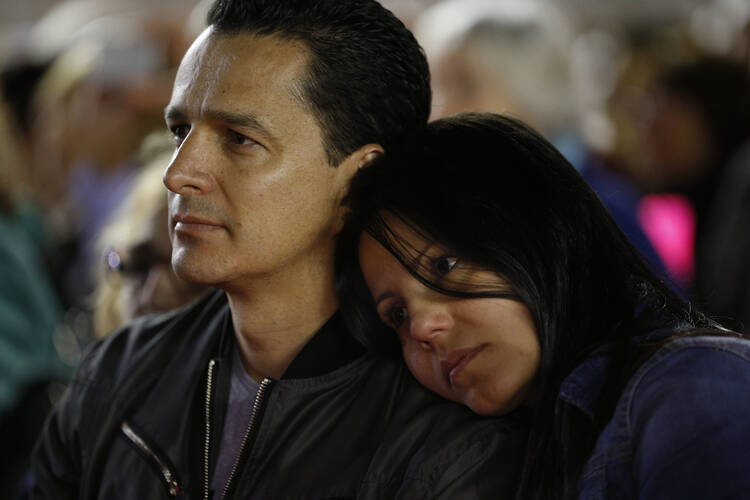 A couple attend a prayer vigil for the Synod of Bishops on the family in St. Peter's Square at the Vatican in this Oct. 3, 2015, file photo. 