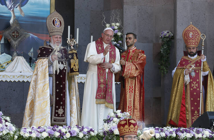 Pope Francis, accompanied by Catholicos Karekin II, patriarch of the Armenian Apostolic Church, gives his blessing at the conclusion of a divine liturgy at Etchmiadzin in Vagharshapat, Armenia, June 26 (CNS photo/Paul Haring).