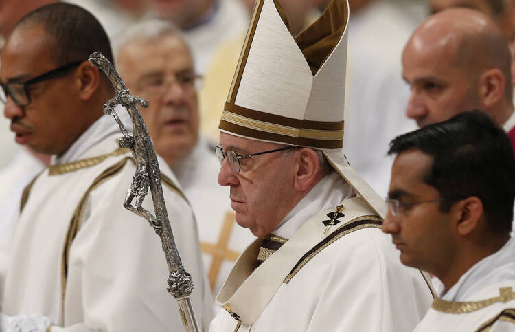 Pope Francis arrives to celebrate the Holy Thursday chrism Mass in St. Peter's Basilica at the Vatican, March 24 (CNS photo/Paul Haring). 