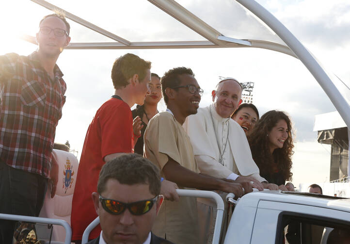 Pope Francis arrives with World Youth Day pilgrims for the July 30 prayer vigil at the Field of Mercy in Krakow, Poland (CNS photo/Paul Haring).