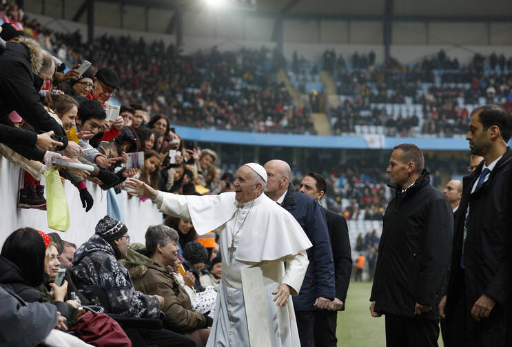 Pope Francis greets people before celebrating Mass at the Swedbank Stadium in Malmo, Sweden, Nov. 1 (CNS photo/Paul Haring).