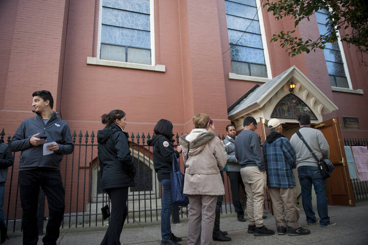 Voters wait outside a polling location for the presidential election Nov. 8 shortly after polls opened at Annunciation Church in Philadelphia. (CNS photo/Tracie Van Auken, EPA)