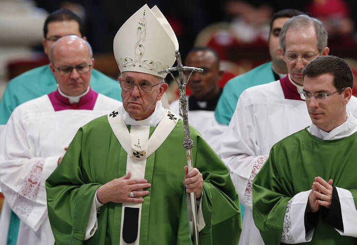 Pope Francis leaves after celebrating the closing Mass of the Synod of Bishops on the family in St. Peter's Basilica at the Vatican, Oct. 25 (CNS photo/Paul Haring).