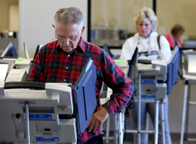 Voters cast ballots in Cleveland as early absentee voting began Oct. 12 ahead of the Nov. 8 U.S. presidential election (CNS photo/Aaron Josefczyk, Reuters).