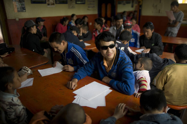 Blind people are seen at school in Lhasa, Tibet, in this Sept. 2, 2011, file photo. Sabriye Tenberken, a German who went fully blind at the age of 12, runs a school for the blind there (CNS photo/Wu Hong, EPA). 