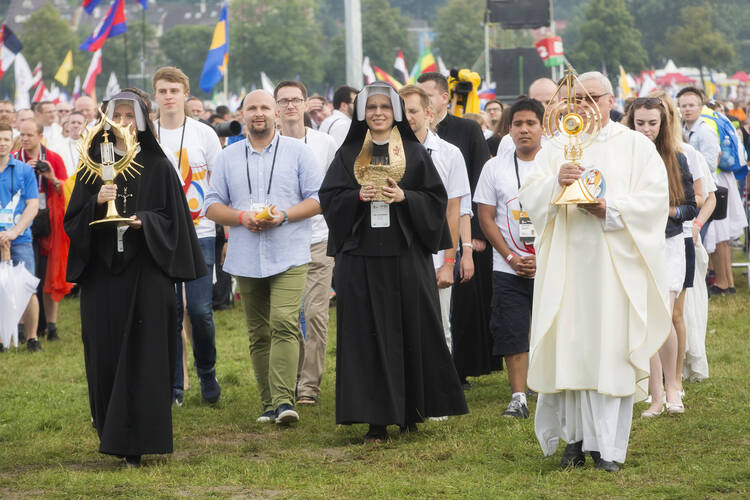 Relics of Sts. Faustina Kowalska and John Paul II are carried into the opening Mass for World Youth Day in Krakow, Poland, July 26. (CNS photo/Jaclyn Lippelmann, Catholic Standard)