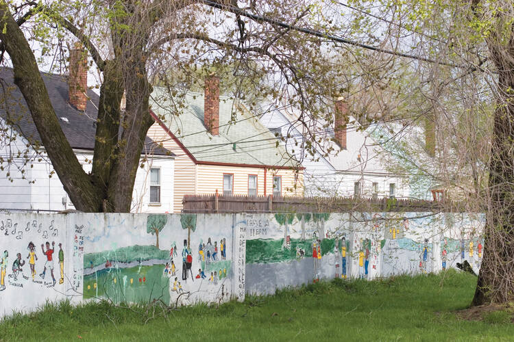 COLOR LINES. This wall, pictured in 2005, was built in the 1940s to enforce residential segregation in Detroit. The wall still stands, even though neighborhoods on both sides are now uniformly African-American.