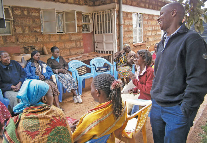 ROUNDTABLE: Stephen Nzioki, S.J., speaks with women being counseled and medically treated for H.I.V. through a Catholic program in Nairobi, Kenya. 