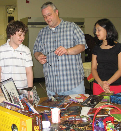 The Rev. Michael Bernier uses Harry Potter memorabilia in a presentation about spirituality at St. Mary High School, Westfield, Mass.