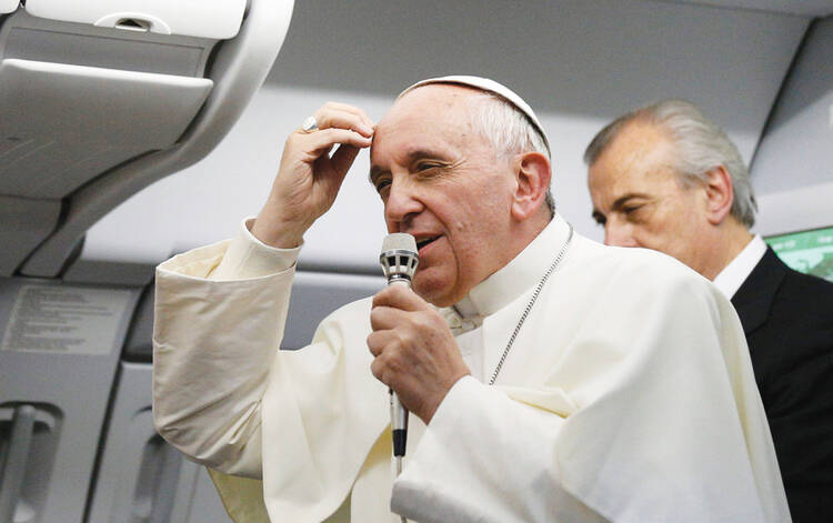 WHO AM I TO JUDGE? Pope Francis aboard the papal flight from Rio de Janeiro to Rome, July 28.