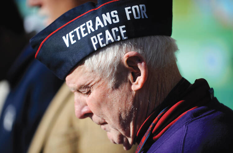 Honor Roll: George McVey helps read the names of troops who have been killed in Iraq and Afghanistan