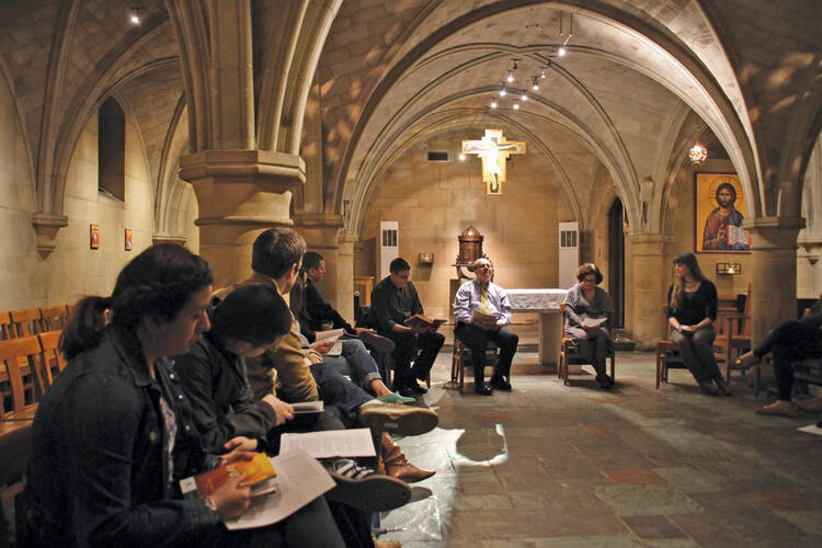 THE RITE STUFF. Ennio Mastroianni, center, helps lead a group of catechumens with Patrick Rogers, S.J., and Minerva San Juan in a chapel at Georgetown University in Washington, D.C., Feb. 20.