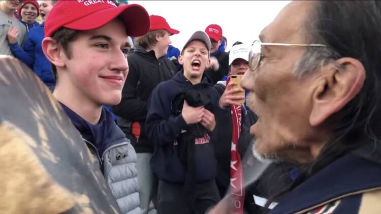 Screengrab from a viral video showcasing a confrontation between a Native American drummer and a group of Catholic high school students in Washington, D.C. on Jan. 18, 2019. Screenshot via YouTube.