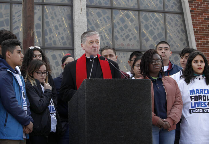 Cardinal Blase Cupich and young members of Immaculate Conception Catholic Church in Chicago spoke out against gun violence during a Good Friday peace walk on March 30. (Photo: Archdiocese of Chicago.)