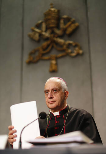 Bishop Fisichella attends presentation of 'Evangelii Gaudium' from Pope Francis during news conference at Vatican (CNS photo/Alessandro Bianchi, Reuters)